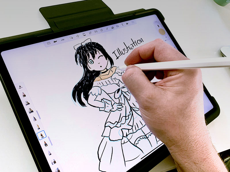 main avec stylet entrain de dessiner un manga sur une tablette graphique